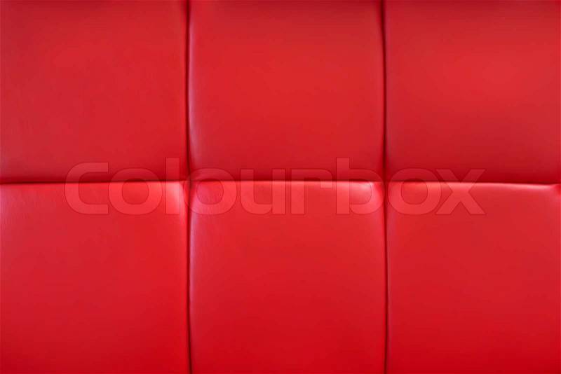 Covering of furniture with bright red artificial material, stock photo