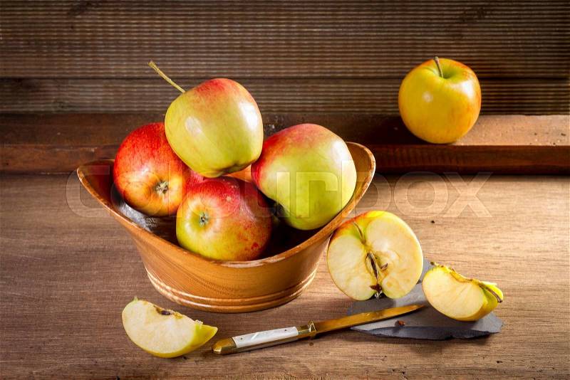 Ripe red bio apples on table. Vintage style, stock photo