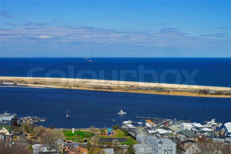 Houses and Atlantic Ocean shore viewed from the light house at Sandy Hook. Sandy Hook is in New Jersey, USA, stock photo