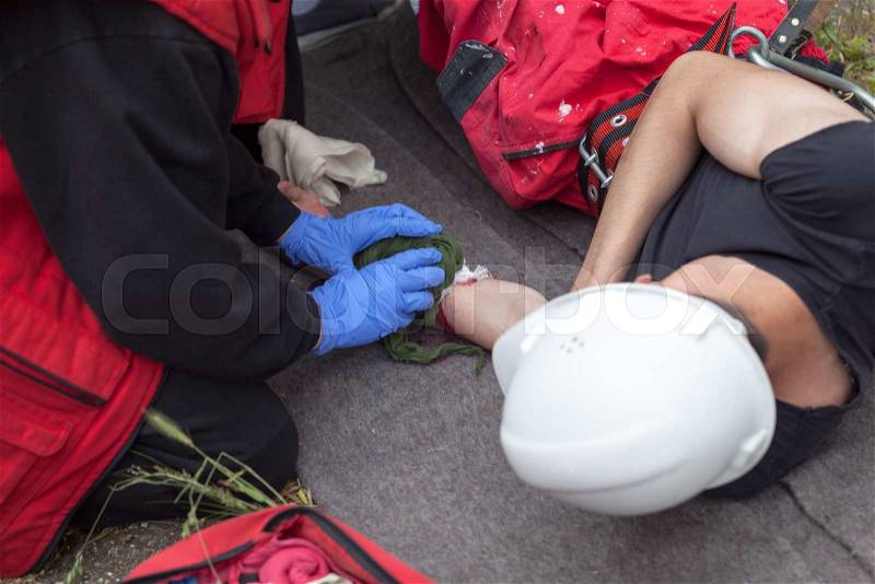 Workplace accident - First aid after occupational injury. Hand injury, stock photo