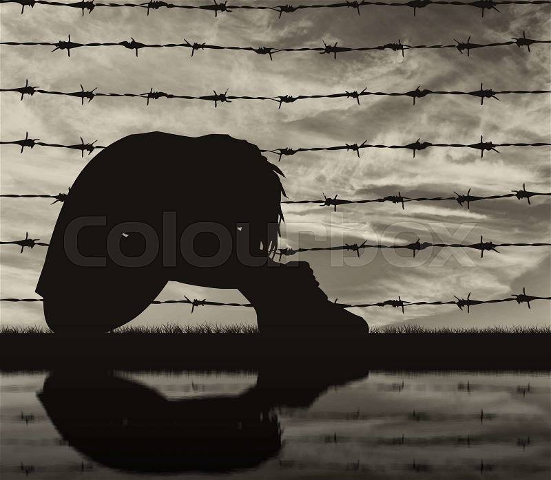 Concept of refugee. Silhouette Despair refugee woman near the fence of barbed wire and reflection, stock photo