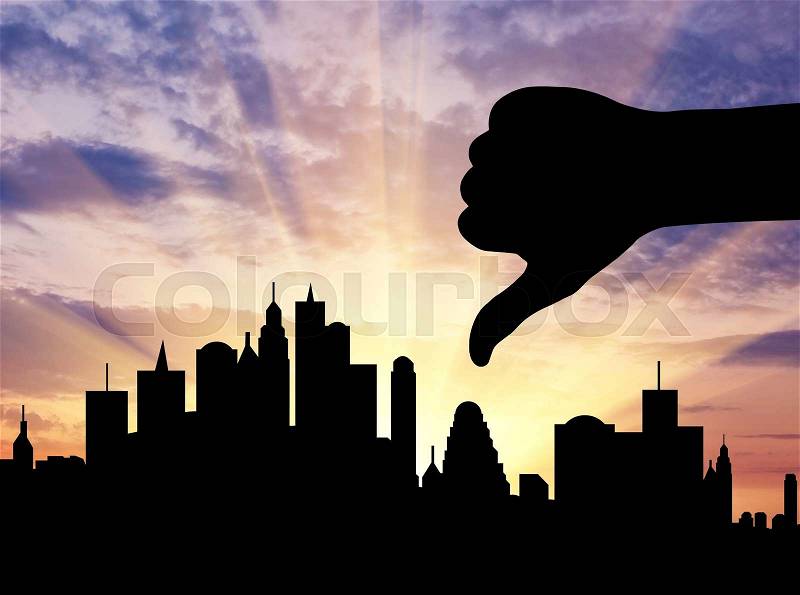 Concept of business. Silhouette hand gesture not like against the evening city, stock photo