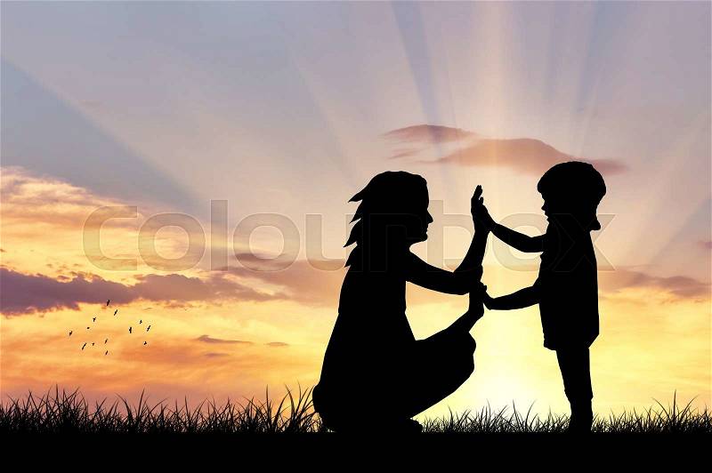 Silhouette of a happy family with children on the background of a sunset, stock photo