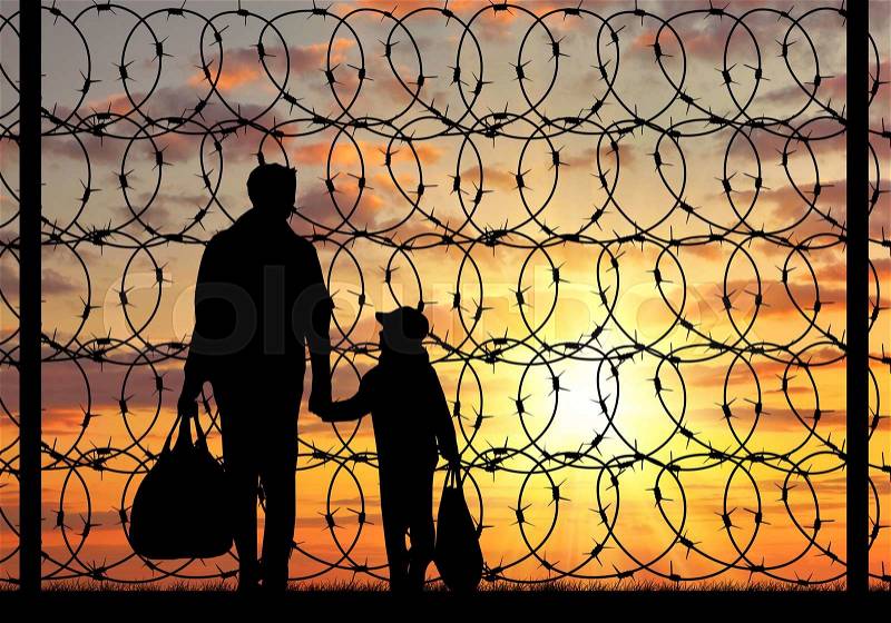 Concept of refugee. Silhouette of a family with a child refugee father near the fence with barbed wire at sunset, stock photo