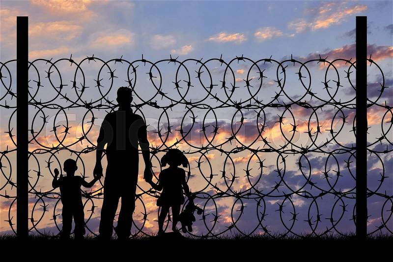 Concept of security. Silhouette of refugee men and metal fence with barbed wire on the background of night sky, stock photo