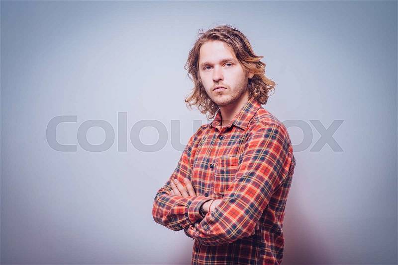 Portrait of a man arms folded, stock photo