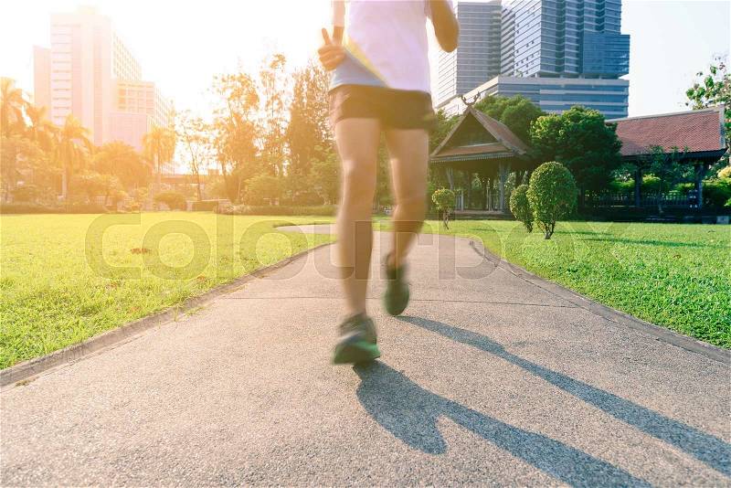 Motion blur of marathon man runner in beautiful urban running track. , stock photo