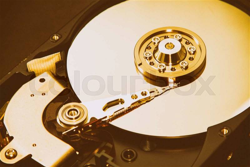 Close up of hard disk\'s internal mechanism hardware, stock photo