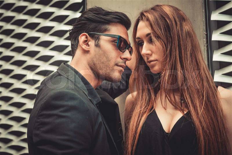Young trendy man and woman in love passion emotions of the modern street. Fashion Style, stock photo