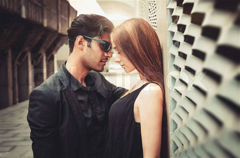 Young trendy man and woman in love passion emotions of the modern street. Fashion Style, stock photo