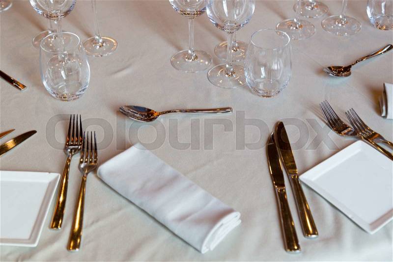 Restaurant with table settings for a dinner party, stock photo
