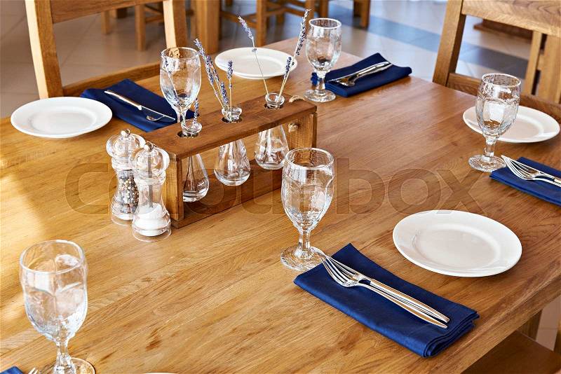 Serving dinner table in a restaurant, stock photo