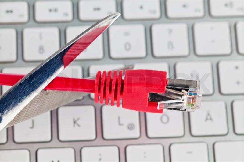 The red wire of a network from a computer. Separated with scissors, stock photo