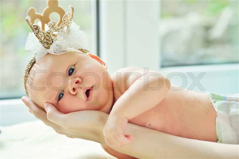 A little newborn princess on the mother\'s hand, stock photo