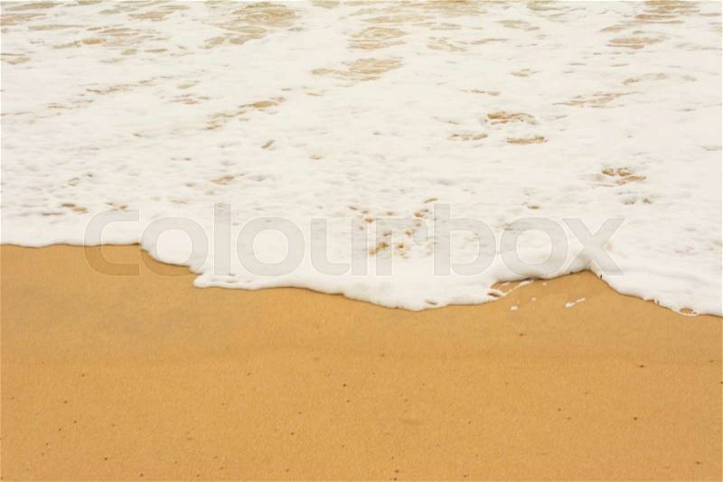 Sea wave and many foot print on the beach background, stock photo