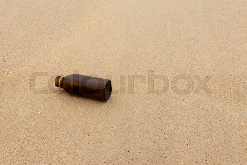 Empty water bottle on the beach background, stock photo