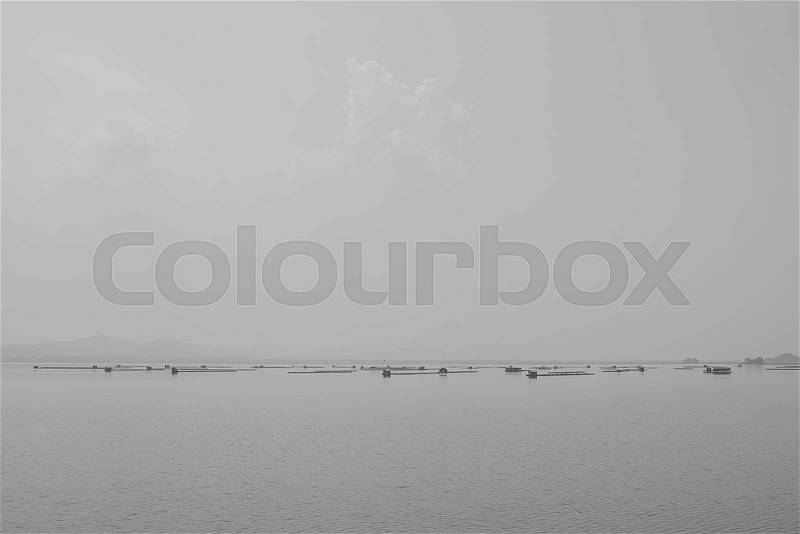 Fish coop, Fish cages Krasiao dam. Suphanburi province, Thailand. black and white picture, stock photo