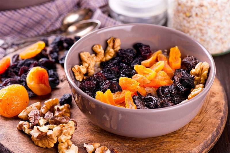Oatmeal with raisins, dried apricots, plums, stock photo