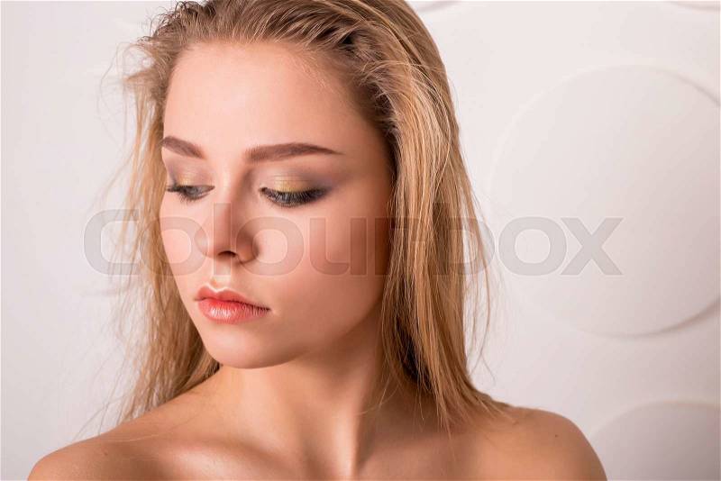 Lady with natural make-up and blonde hair studio fashion shot, stock photo