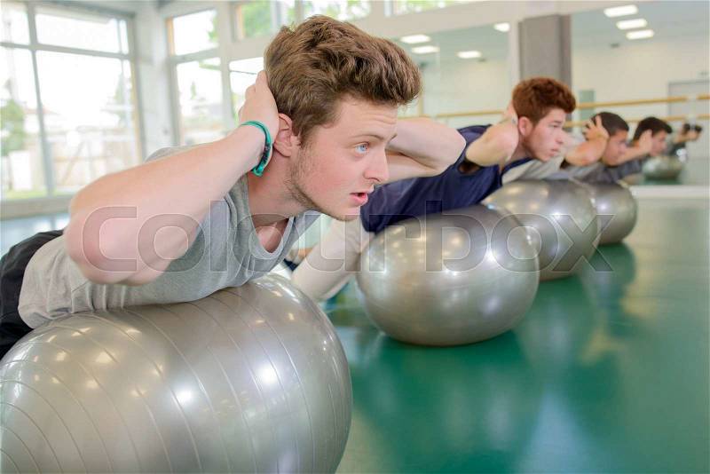 Men on their gym ball, stock photo