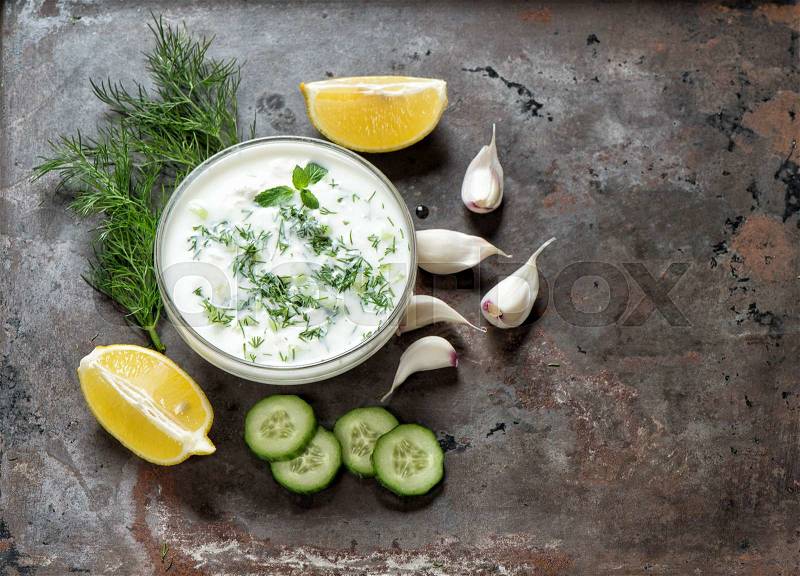 Tzatziki sauce. Fresh dip with herbs dill and mint. Food background, stock photo