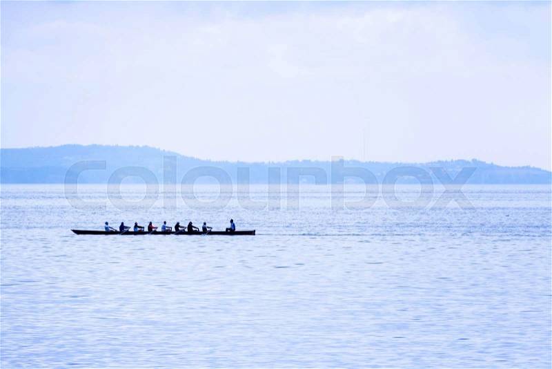 Rowing boat with coxswain. success through team spirit and motiv, stock photo