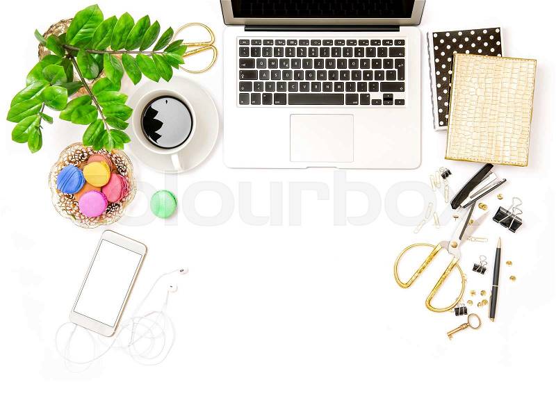 Workplace for business lady. Office supplies and laptop. Creative working. Coffee and macaroon cookies. Flat lay, stock photo