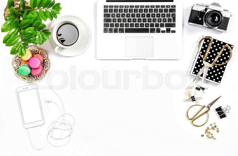 Business still life. Feminine home office desk. Coffee and colorful macaroon cookies. Flat lay. Hero header for social media, stock photo