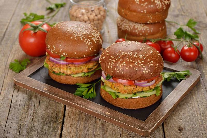 Vegetarian burger on a wooden background, stock photo