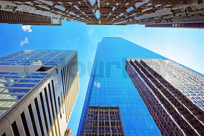 Bottom up view on skyscrapers mirrored in glass in Philadelphia, Pennsylvania, USA. It is central business district in Philadelphia, stock photo