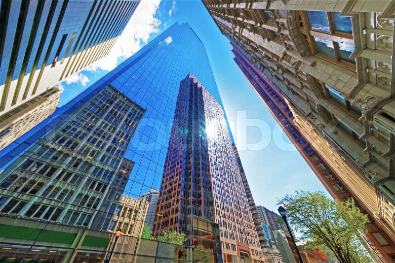 Bottom up view on skyscrapers reflected in glass in Philadelphia, Pennsylvania, USA. It is central business district in Philadelphia, stock photo