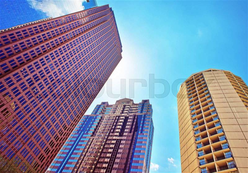 Bottom up view on skyscrapers mirrored in the glass in Philadelphia, Pennsylvania, USA. It is central business district in Philadelphia, stock photo