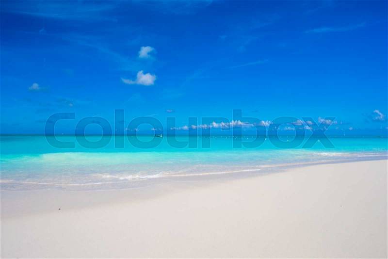 Beautiful white sand beach and turquoise clean water on tropical exotic island, stock photo