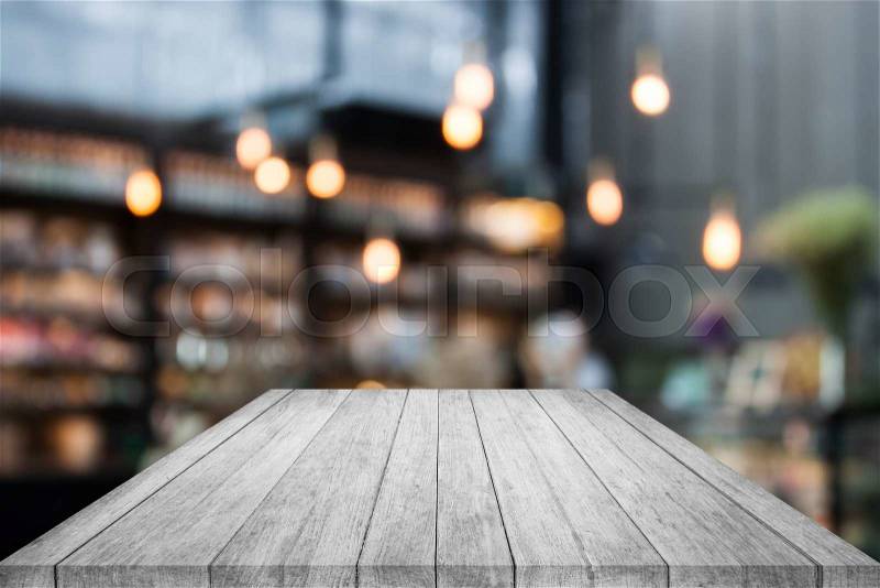 Black and white table top wood with coffee shop blurred background with bokeh, stock photo