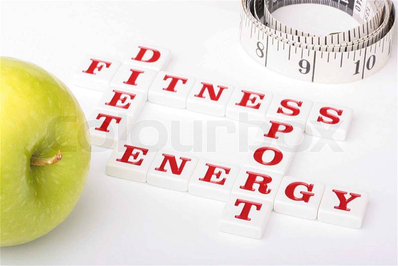 Creative on a theme of a healthy way of life. From ceramic letters the combination of words fitness, a diet, energy and sports is collected, stock photo