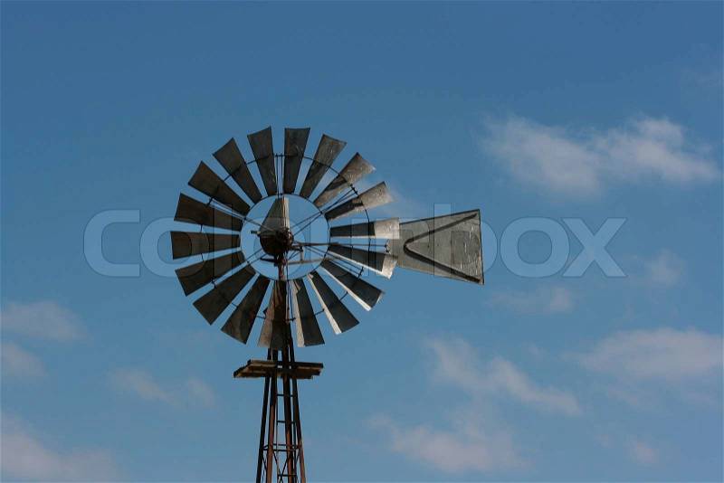 The old mechanism using a strength of wind for its transformation to mechanical energy, stock photo