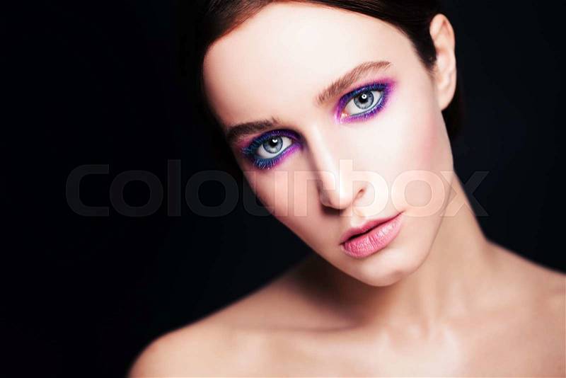 Fashion Model with Bright Make-up on Dark, stock photo