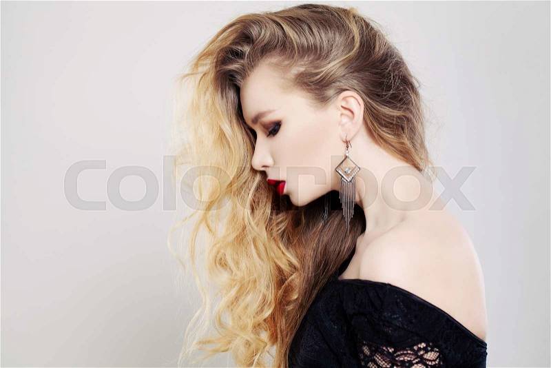 Beautiful Woman with Long Wavy Blonde Hair. Female Profile, stock photo