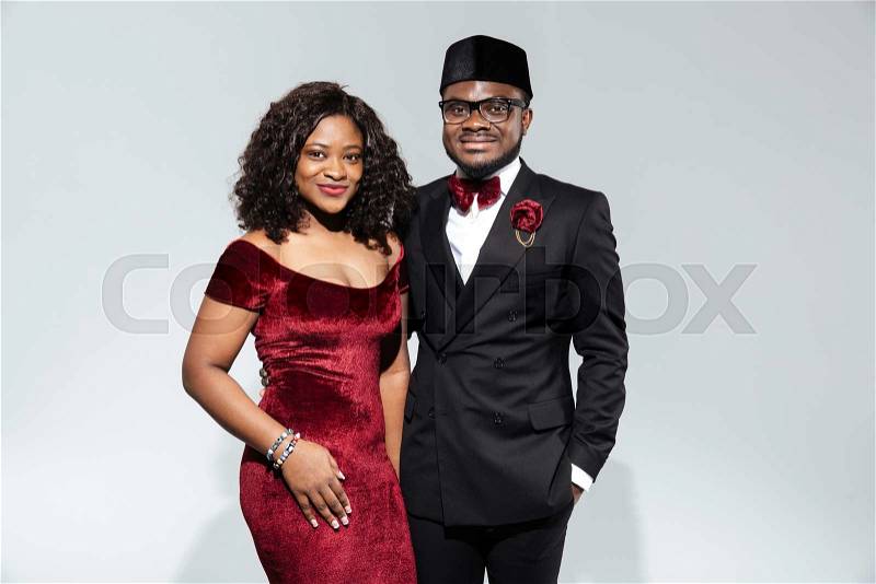 Fashion afro american couple standing isolated on a white background and looking at camera, stock photo