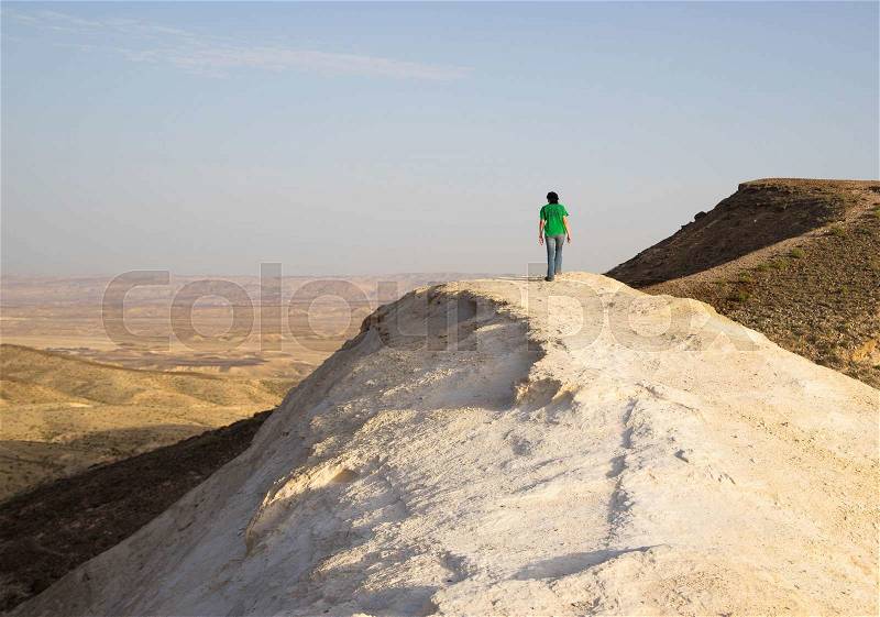 People hiking for health in israeli desert travel, stock photo