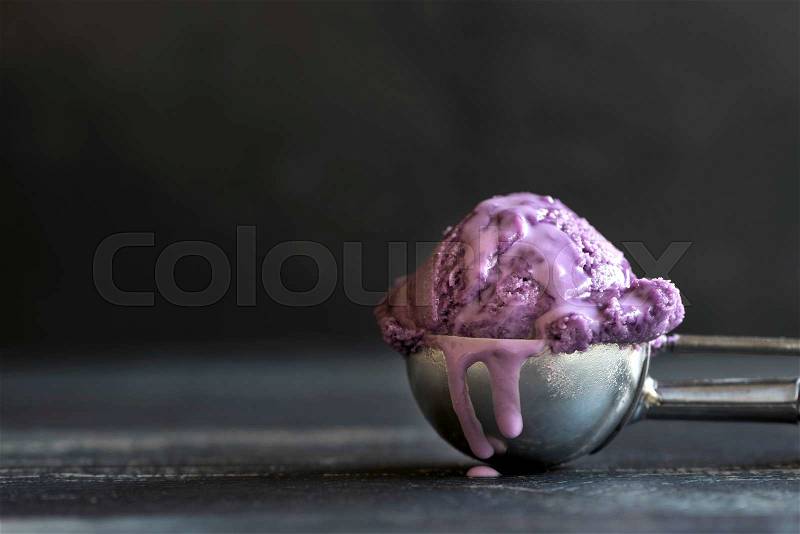 Scoop of blueberries ice cream,selective focus and empty space for ads , stock photo