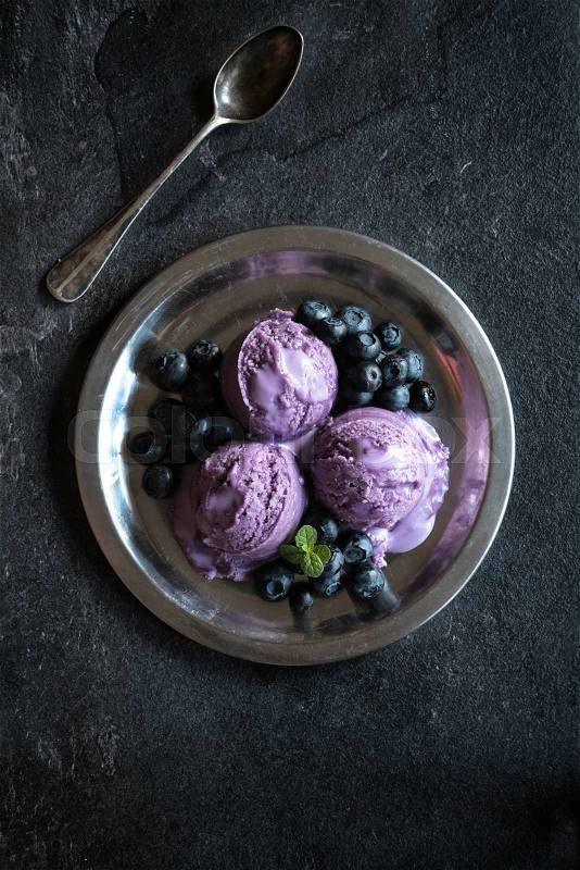 Scoops of blueberries ice cream in metal plate,selective focus , stock photo