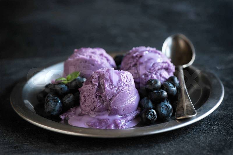 Scoops of homemade blueberry ice cream in metal plate,selective focus, stock photo