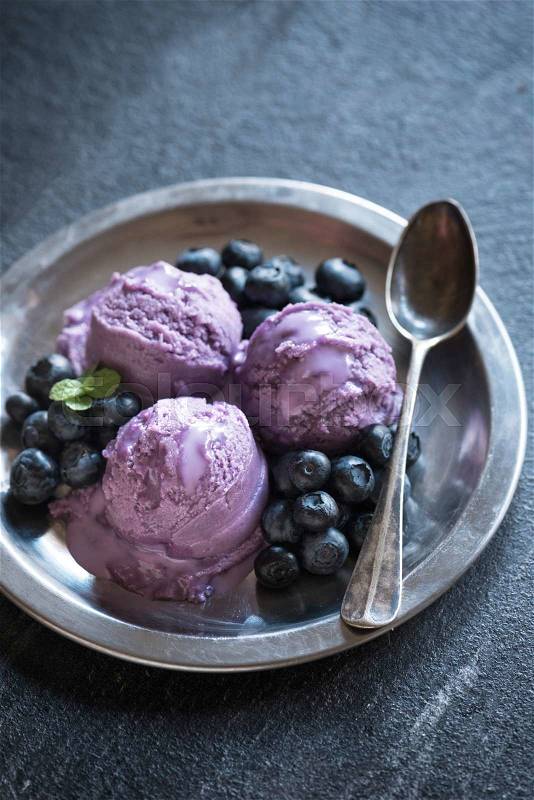 Scoop of blueberries ice cream in metal plate,selective focus, stock photo