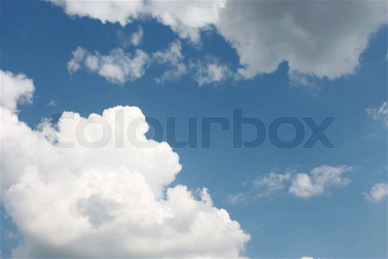 White and gray clouds with a gleam of the blue sky, stock photo
