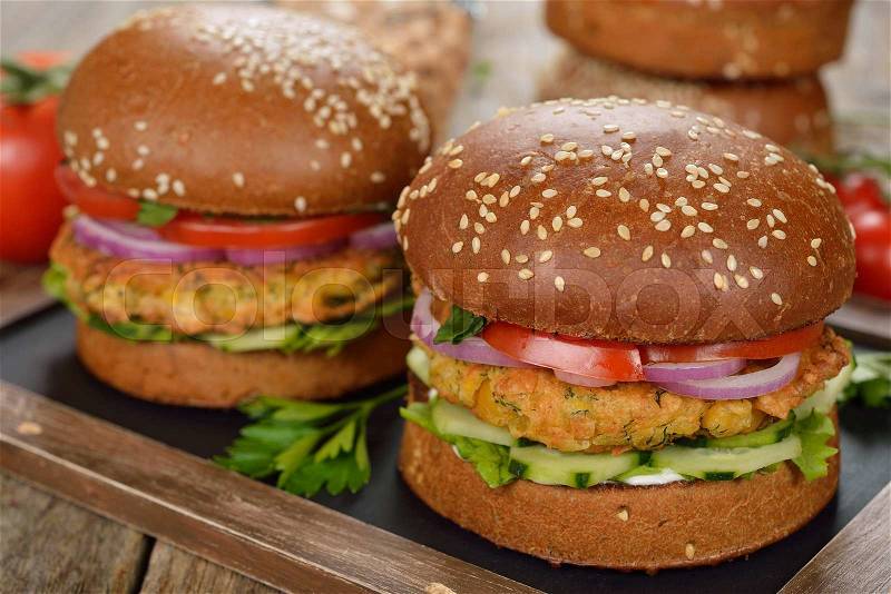 Vegetarian burger on a wooden background, stock photo