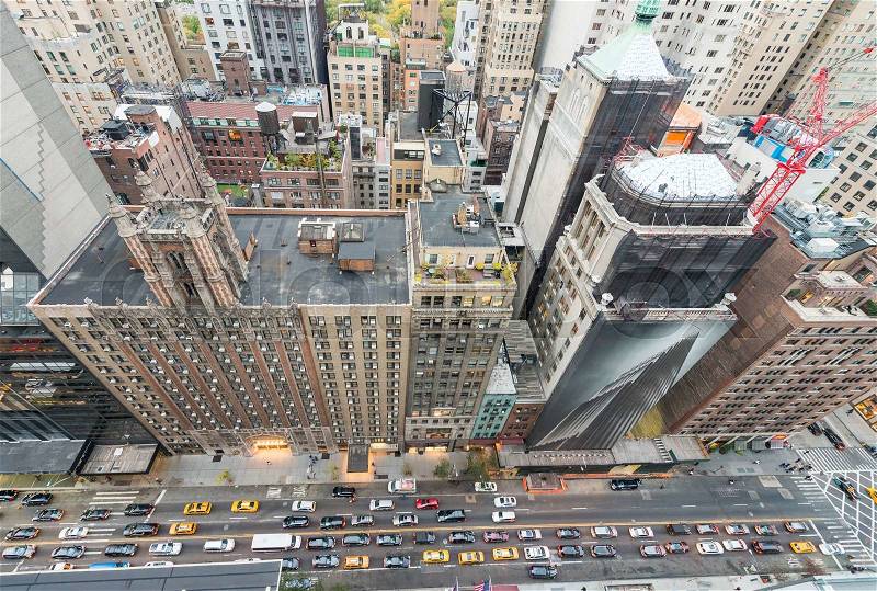 Overhead view of Manhattan buildings and streets at dusk. New York aerial landscape, stock photo