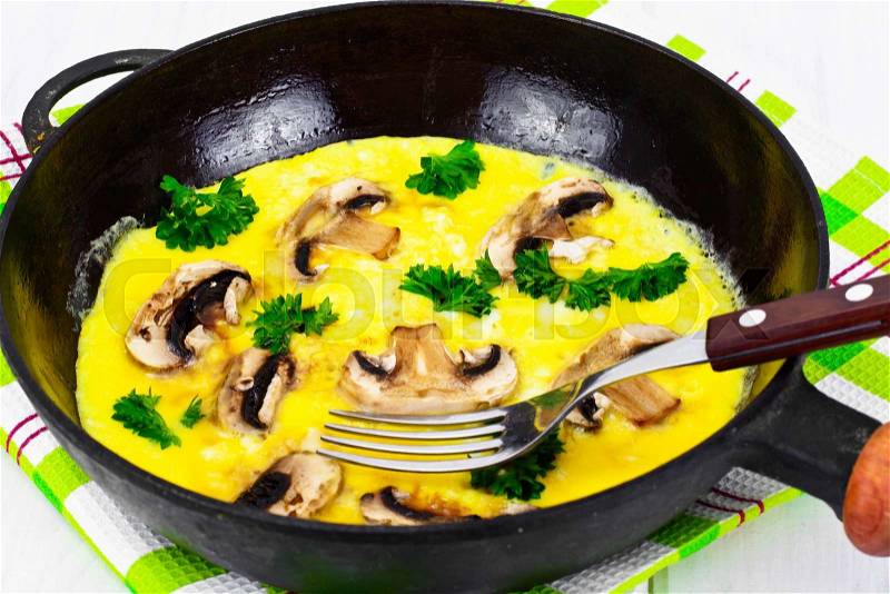 Healthy and Diet Food: Scrambled Eggs with Mushrooms and Vegetables. Studio Photo, stock photo