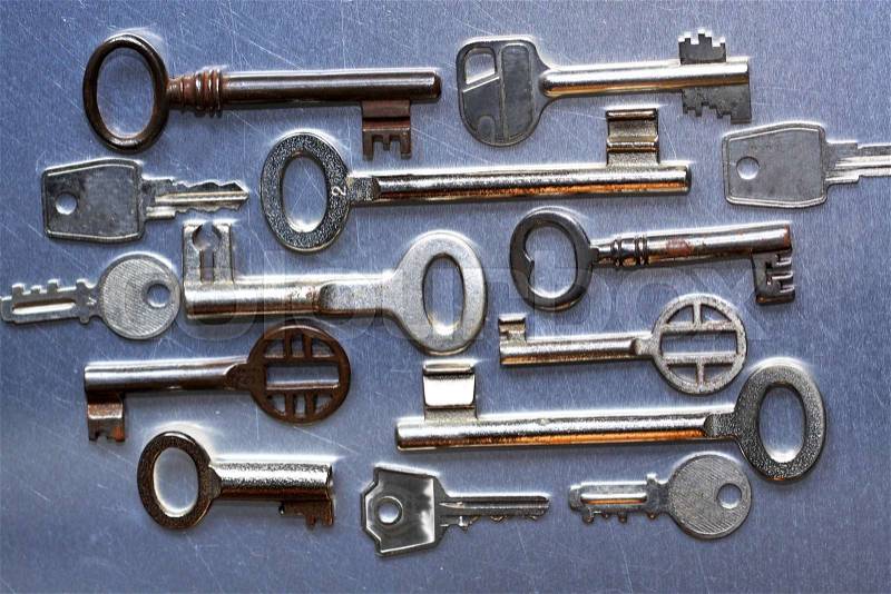 Several old keys Several old keys on a metal background, stock photo
