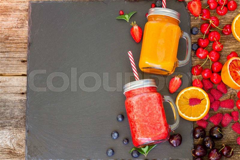 Fresh smoothy citrus and berry drinks with igredients and copy space, stock photo